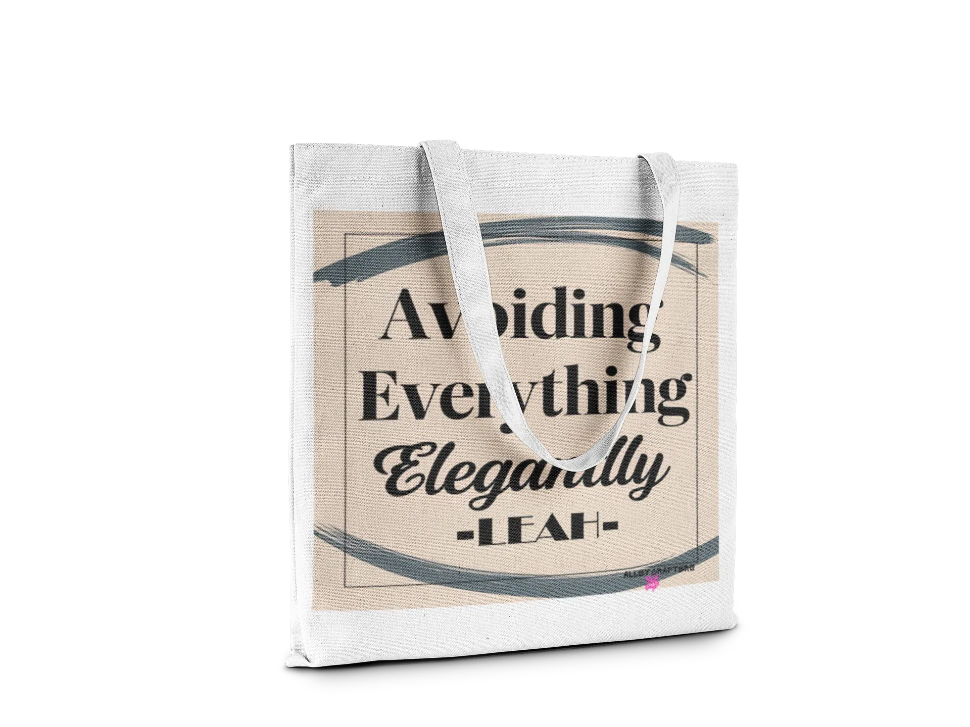 White canvas tote bag with “Avoiding Everything Elegantly” lettering and border graphic