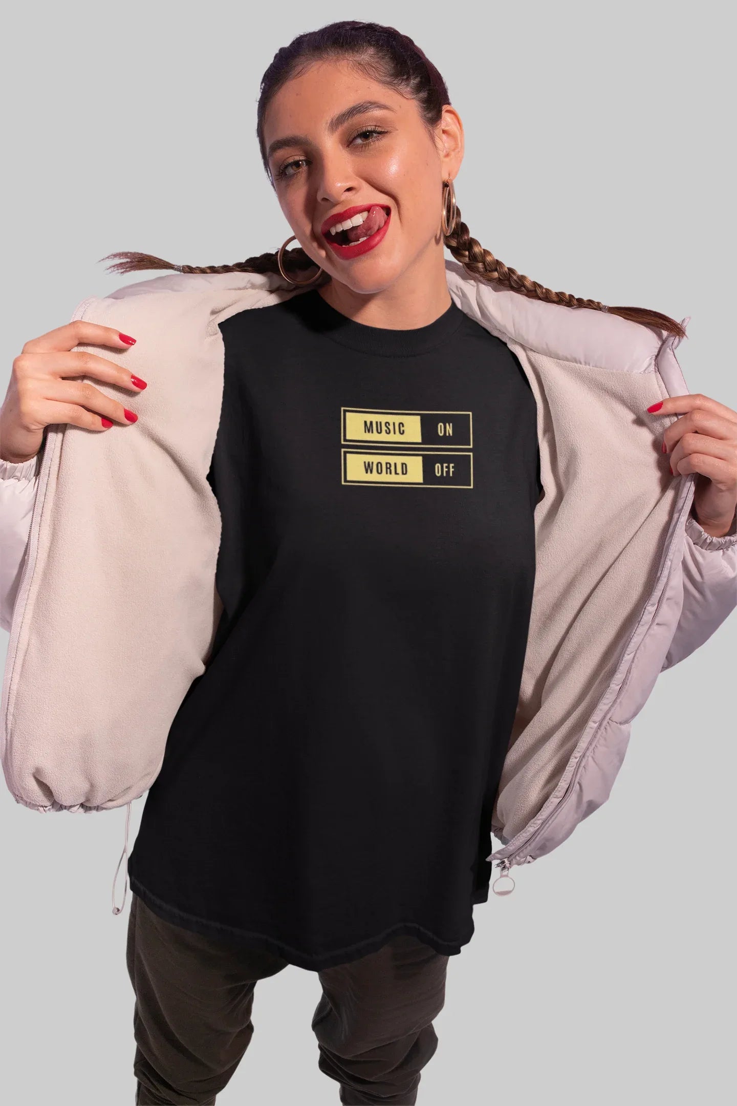 Black unisex T-shirt with “Music On / World Off” chest graphic