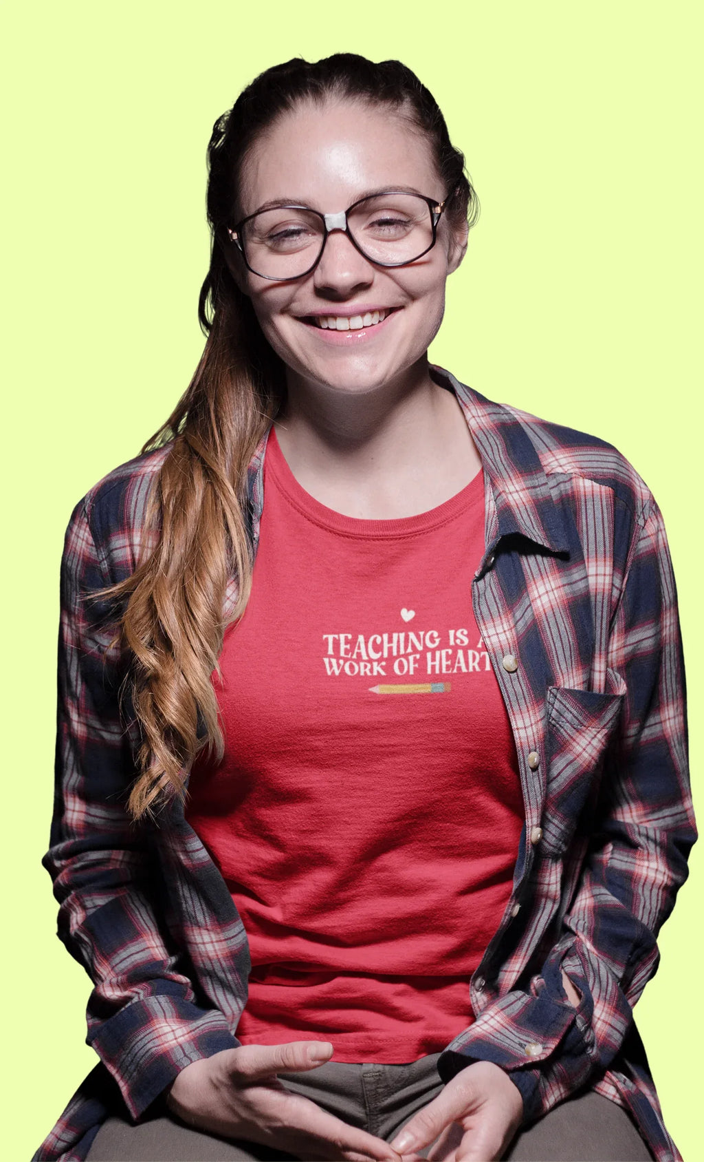 Red unisex T-shirt with crew neck and “Teaching is a Work of Heart” chest print
