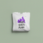 White hoodie folded flat with drawstring hood and purple “TRUST GOD’S PLAN” front print.