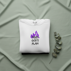 White hoodie folded with drawstring hood and purple “TRUST GOD’S PLAN” logo on chest.