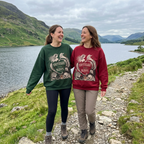 Unisex sweatshirts worn by two people: green and red mermaid “make waves” fronts
