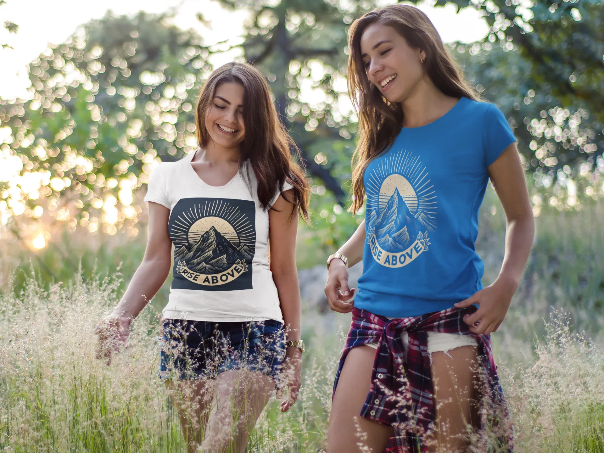 Blue short-sleeve T-shirt with mountain sunrise “RISE ABOVE” graphic on model