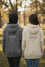 Unisex hoodie sweatshirt pair: dark gray and cream, 'FAITH first' on back