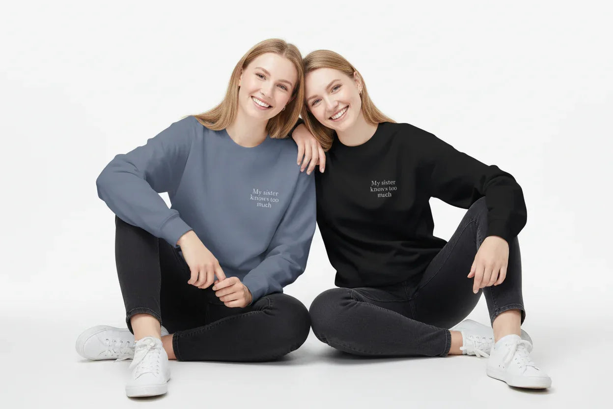 Blue and black crewneck sweatshirts with small chest text, worn by models