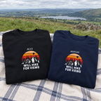 Two Will Hike for Views sweatshirts at a hillside viewpoint