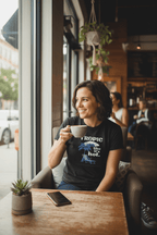 Worn navy crew-neck T-shirt with 'Tropic like it's hot' palm chair graphic
