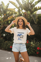 White T-shirt with front tropical graphic and text "TROPIC like it's hot."