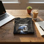 Black T-shirt with “Tropic like it’s hot.” text and palm tree with beach chair graphic