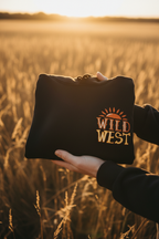 Black hoodie held up with Wild West emblem printed on the front