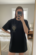 Personalised black t-shirt with floral tree graphic and "In my own season" text, small name