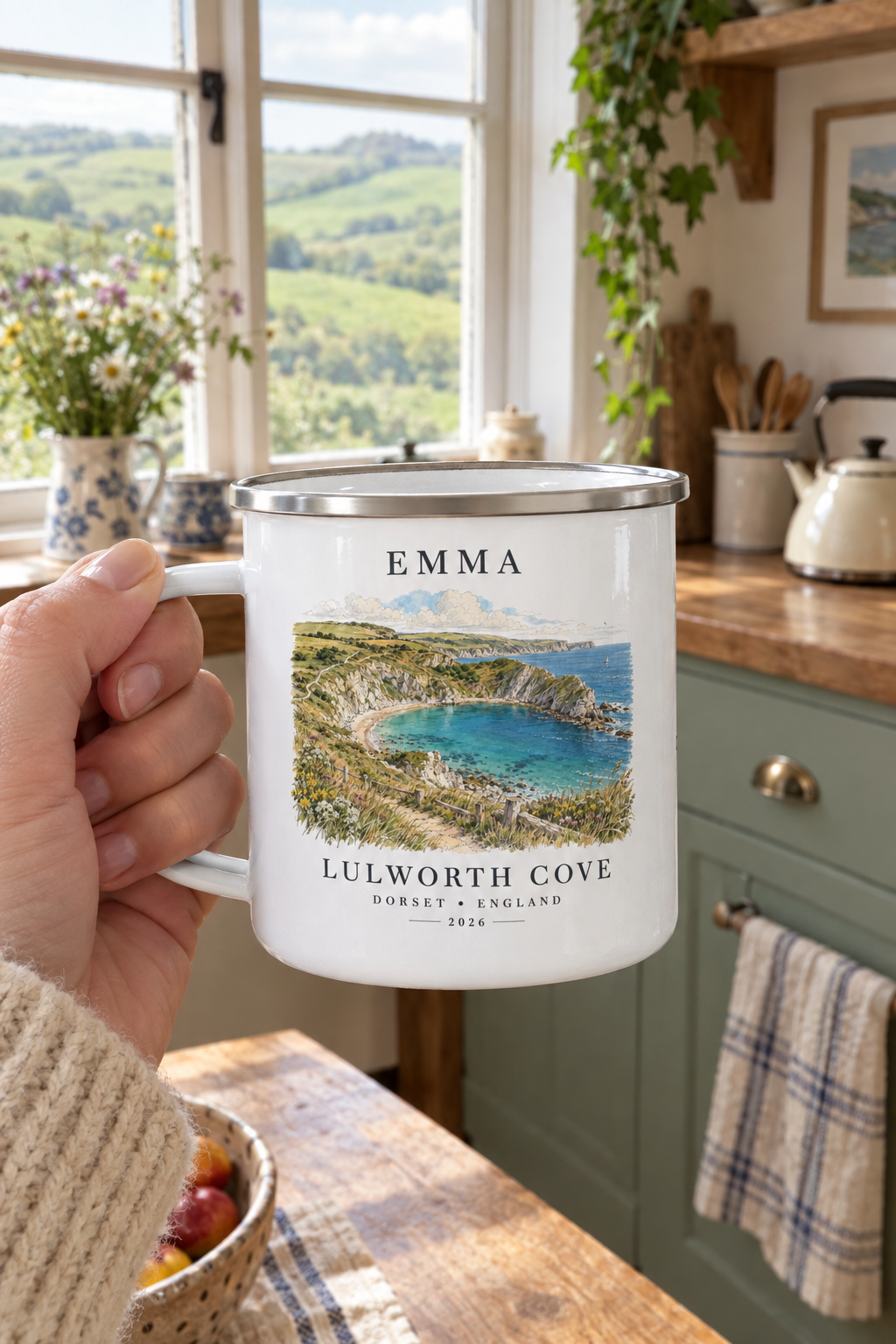 White enamel camping mug with silver rim, 'EMMA' name and Lulworth Cove landscape print