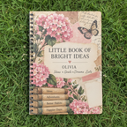 UGC mockup of the Olivia notebook lying on grass, zoomed in