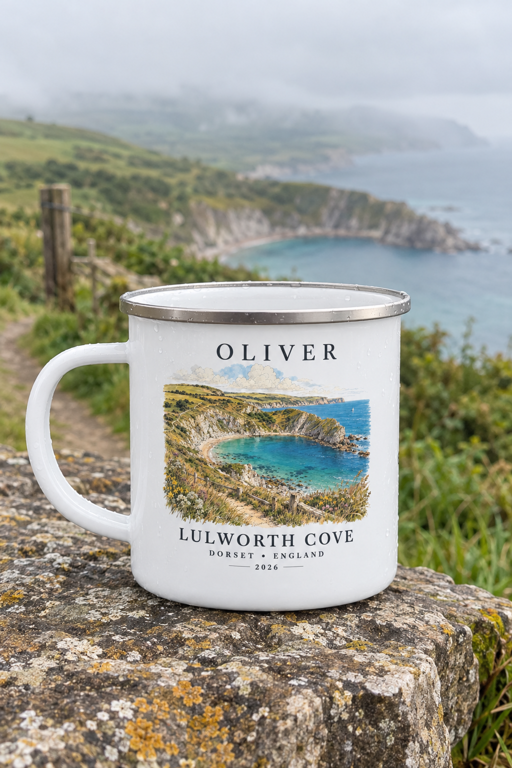 White enamel camping mug with silver rim, 'OLIVER' name and Lulworth Cove landscape print