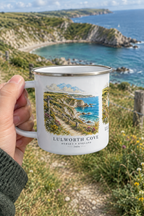 White enamel camping mug with Lulworth Cove coast print, silver rim and handle