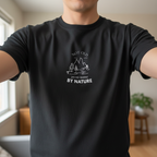 Black nature graphic T-shirt with mountain and tree line art and "BY NATURE" text
