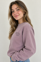 Lilac crewneck sweatshirt with small front text "My sister knows too much"