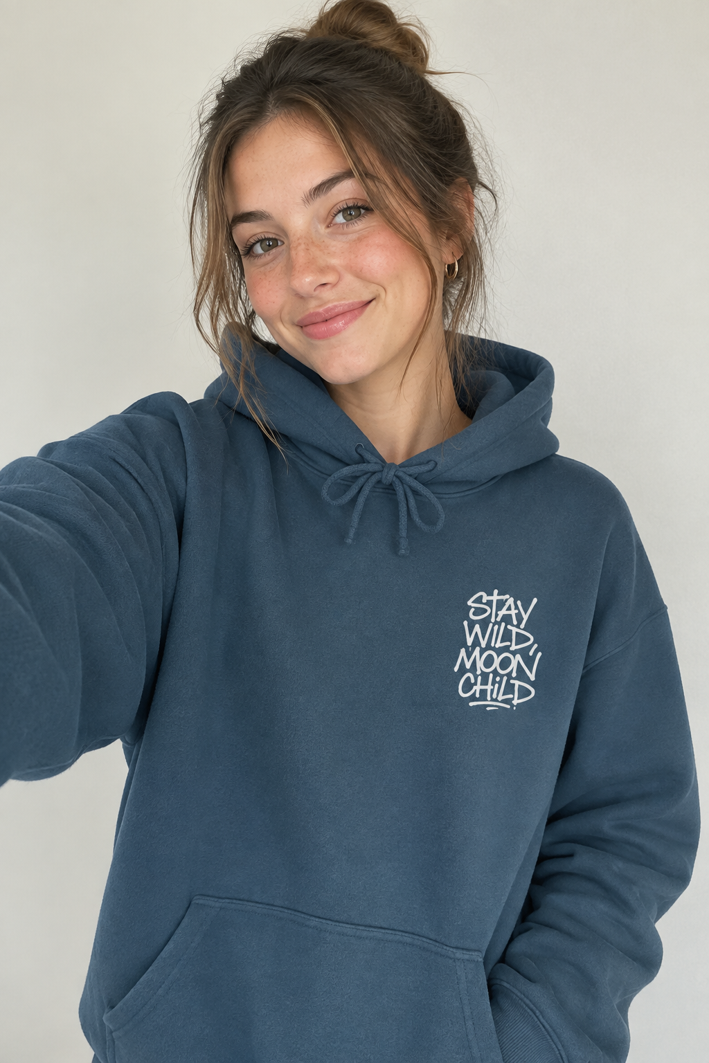 Navy minimal graphic hoodie with drawstring hood, front pocket, white 'Stay Wild Moon Child' print