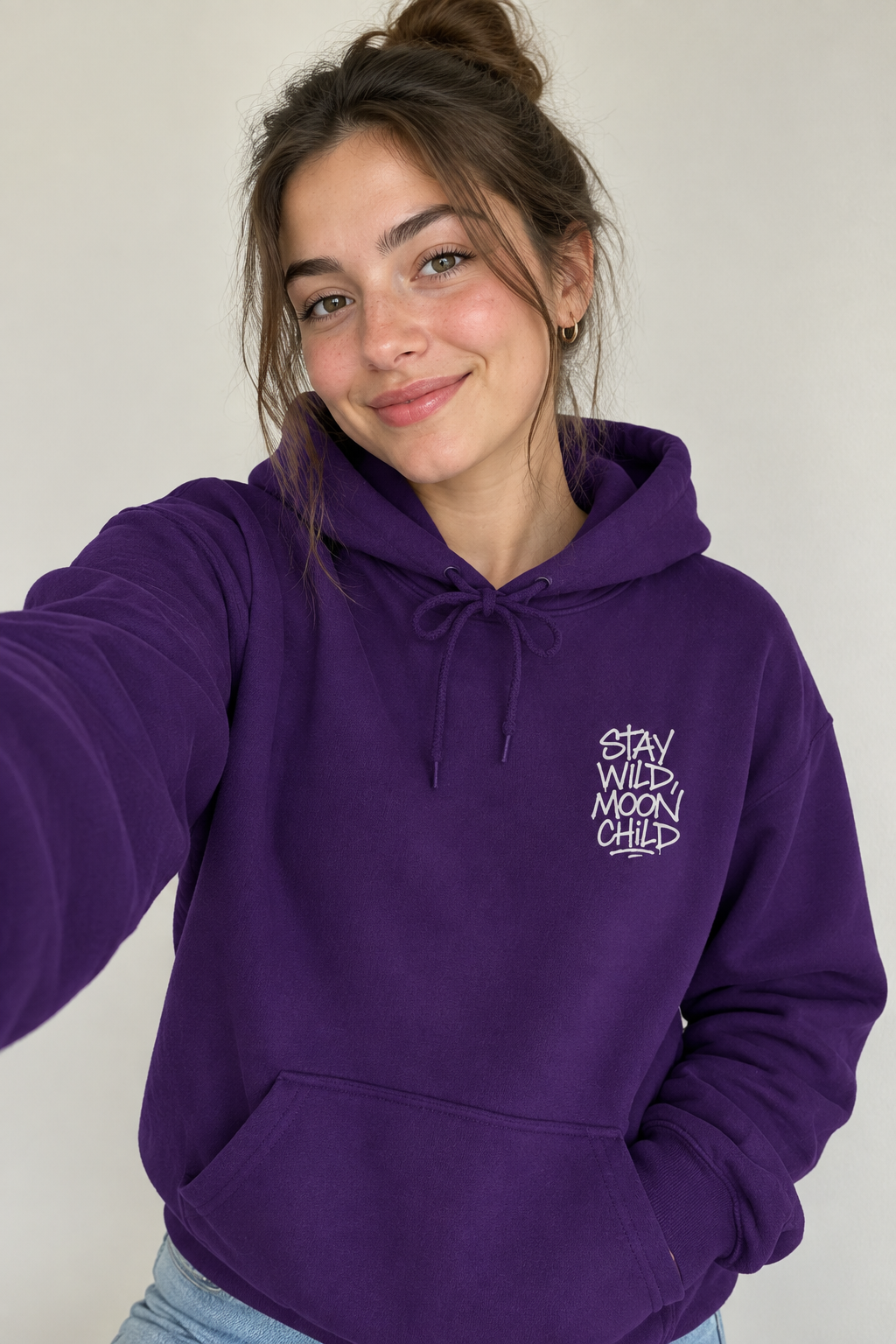 Purple minimal graphic hoodie with drawstring hood and front pocket, white 'Stay Wild Moon Child' print
