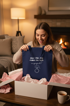 Navy cotton tote bag with ring question graphic and cursive text, held open by hands
