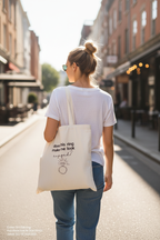 White cotton tote bag with ring icon and 'does this ring make me look engaged?'.
