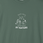 Dark green T-shirt with white mountain and tree graphic, 'By Nature' text