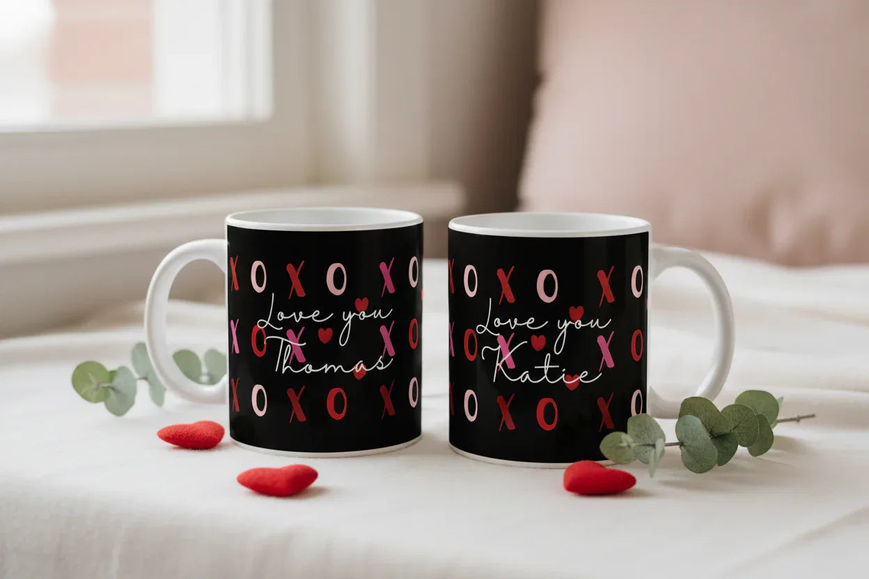 Pair of black ceramic mugs with red XO hearts and “Love you” personalized names