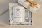 White ceramic mug with diamond ring graphic, 'we said yes' text, in gift box