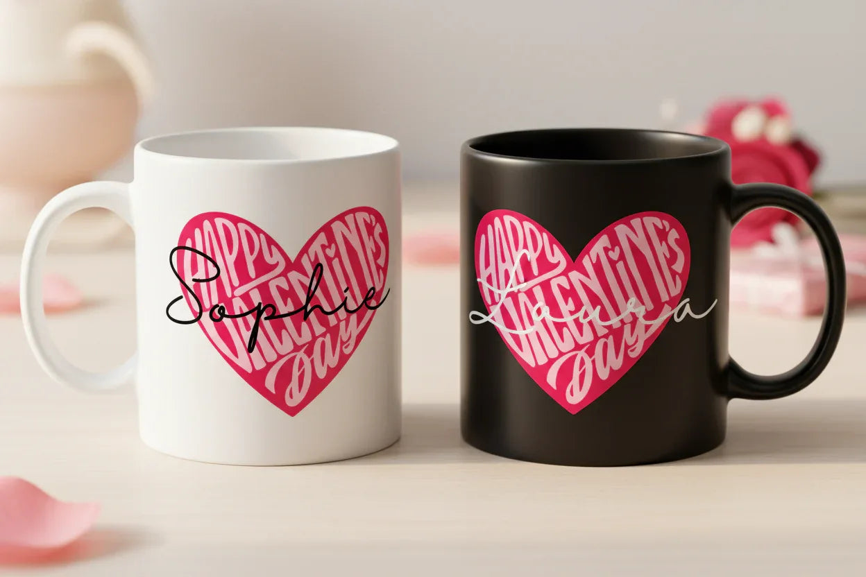 Pair of Valentine's Day mugs, white and black, with pink heart Happy design