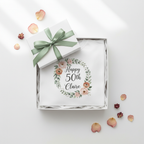 White birthday T-shirt in gift box, floral wreath 'Happy 50th Claire'.