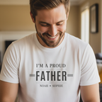 White dad T-shirt close-up with 'I'M A PROUD FATHER' and names NOAH • SOPHIE