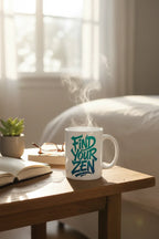 White mug with "Find Your Zen" lettering, rising steam over tabletop