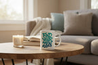 White mug with "Find Your Zen" lettering, on wooden table