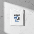 White crewneck T-shirt with tropical palm, umbrella, and “like it’s hot” print