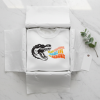 White sweatshirt with crocodile graphic on the front.