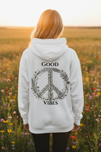 White unisex hoodie on model with back "GOOD VIBES" wreath logo and name line.