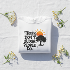 White graphic hoodie with tree and text print at the chest