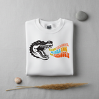 White sweatshirt with crocodile graphic and orange multicolor “grow through” text