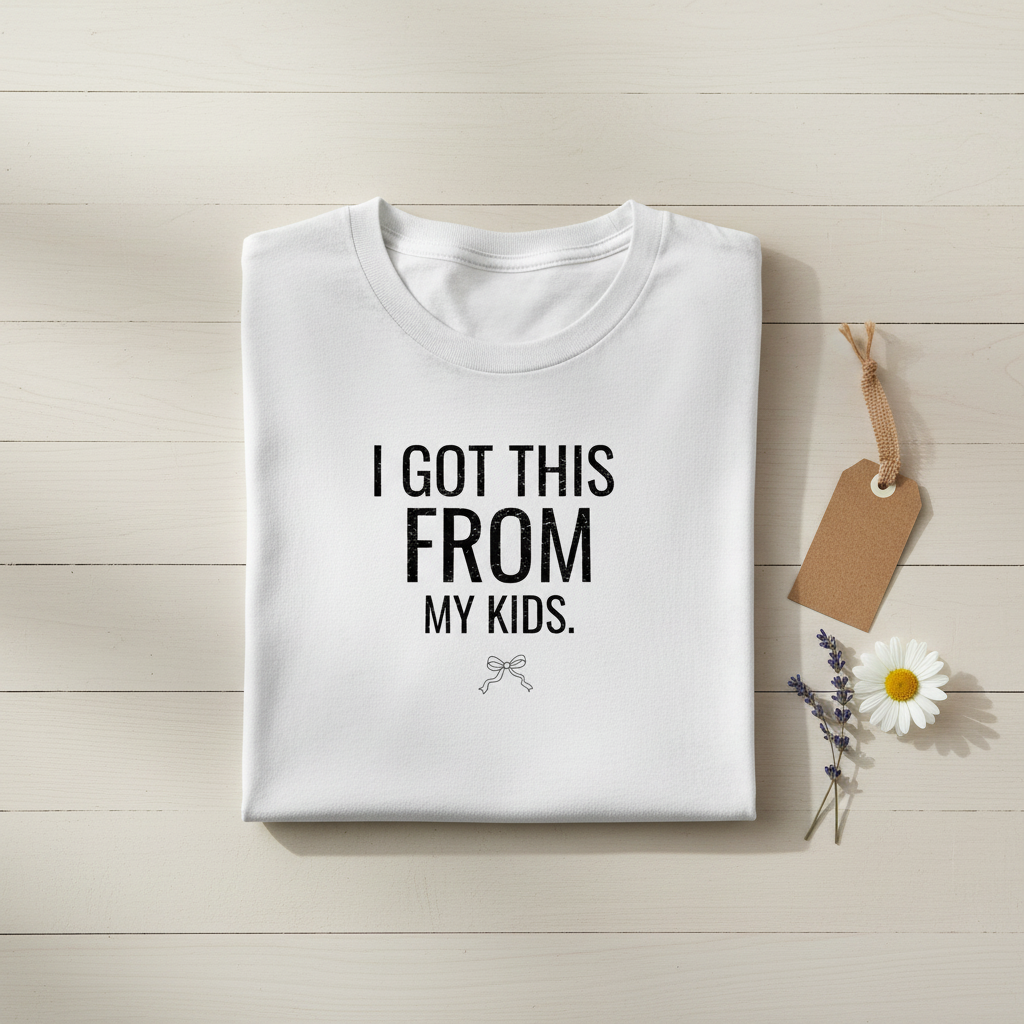 White crew-neck T-shirt with "I GOT THIS FROM MY KIDS" text, flat lay