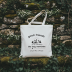 White tote against mossy wall