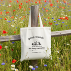 White tote hanging on meadow fence