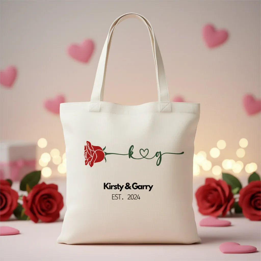 White tote bag with red rose and 'Kirsty & Garry' EST. 2024 text