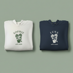 Two pullover hoodies: white SOphie and navy LUNA, each with palm graphic and “wild inside”.