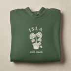 Green hoodie with front hood and eyelet drawstrings; potted palm graphic with “ISLA”.