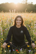 Black custom name sweatshirt with embroidered rainbow arch logo: seraph