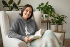 Heather gray pullover hoodie with hood, front pocket, and dancer silhouette graphic