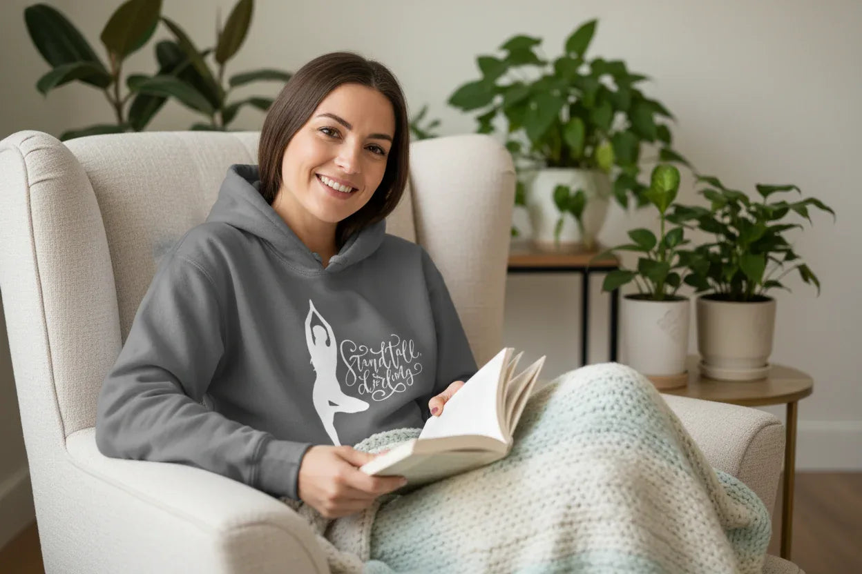 Heather gray pullover hoodie with hood, front pocket, and dancer silhouette graphic