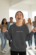 Charcoal crewneck sweatshirt with “big things loading.” printed on the chest.