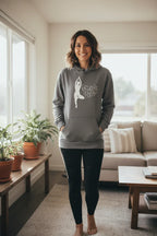 Gray pullover hoodie with hood and front pocket, dancer silhouette graphic on chest