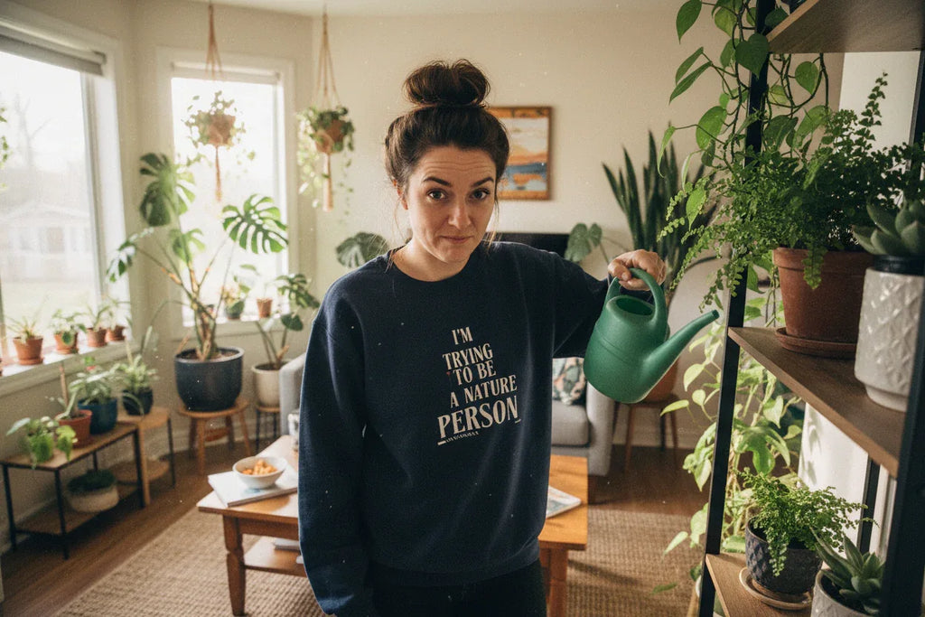 Navy crewneck sweatshirt with 'I’M TRYING TO BE A NATURE PERSON' front text